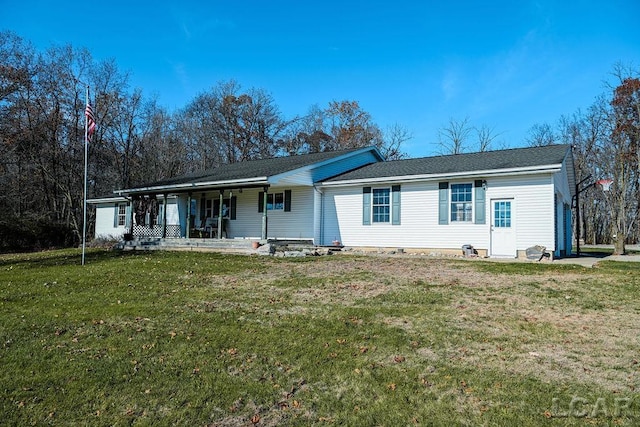 view of front of property with a porch and a front lawn