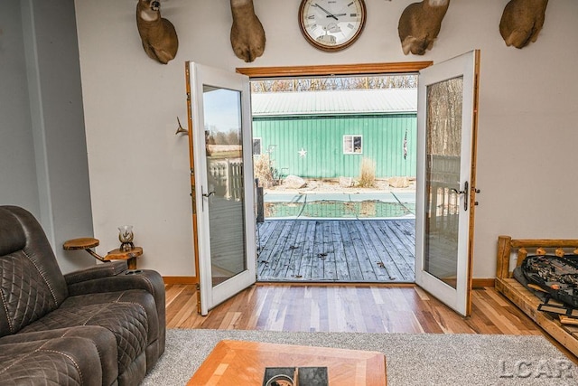 entryway featuring hardwood / wood-style floors, french doors, and a healthy amount of sunlight