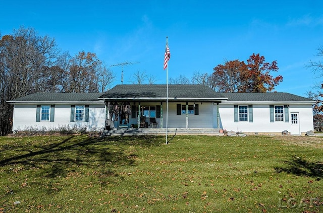 view of front facade featuring a front yard and covered porch