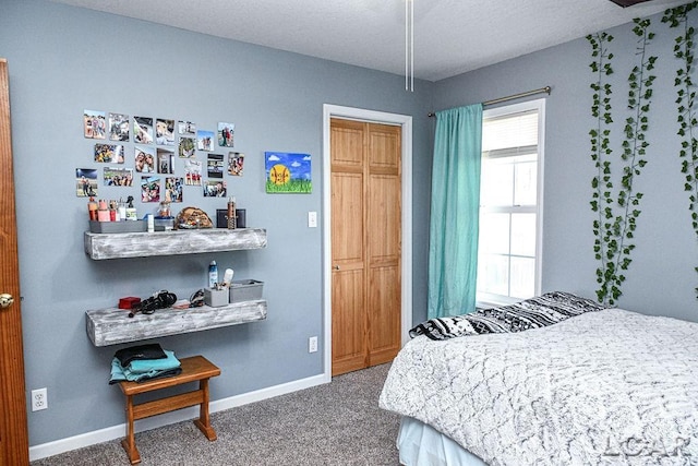 carpeted bedroom with a closet