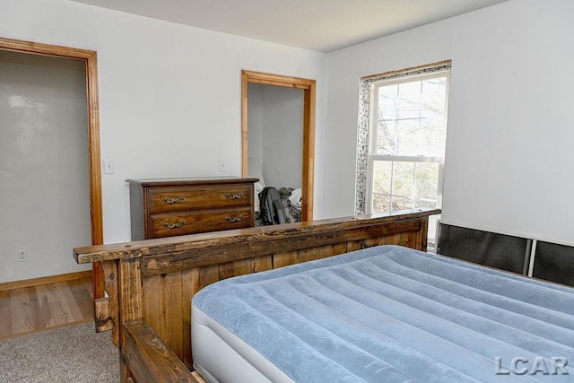 bedroom featuring wood-type flooring