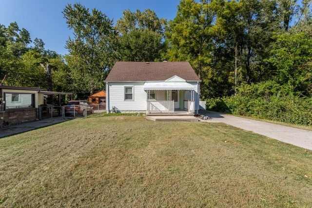 back of house with a yard