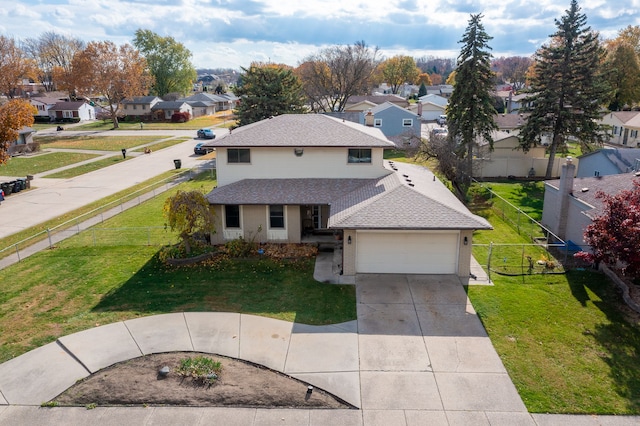 view of front of house featuring a garage and a front lawn