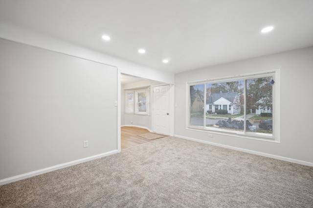 empty room featuring light carpet