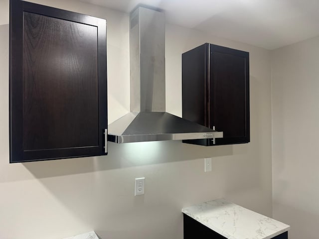 interior details with wall chimney range hood