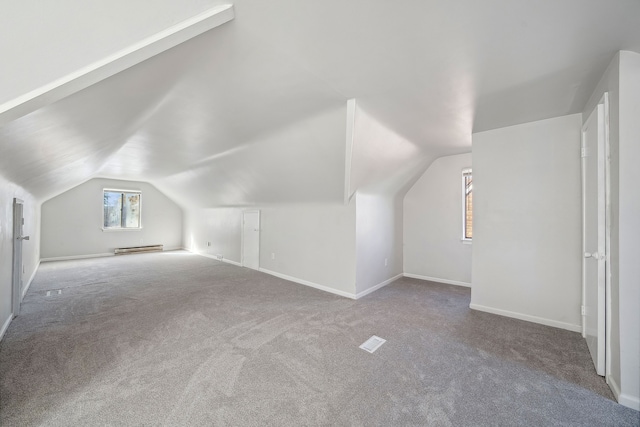 bonus room featuring carpet flooring, lofted ceiling, and a baseboard heating unit