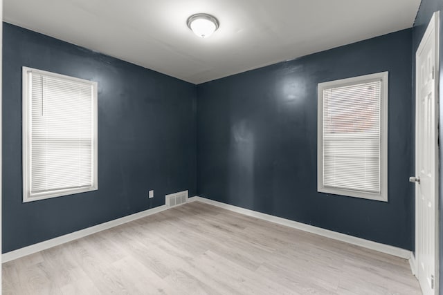 spare room featuring light wood-type flooring