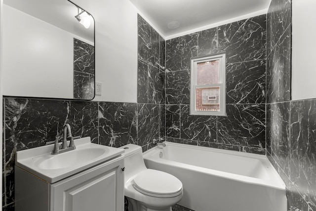 bathroom with vanity, toilet, and tile walls