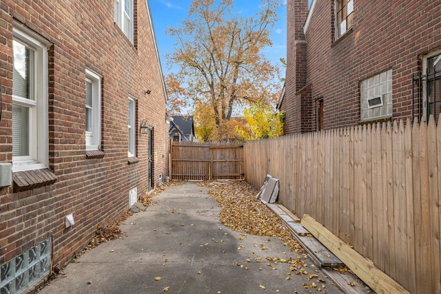 view of side of home with a patio