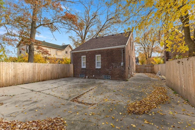 rear view of property featuring a patio area