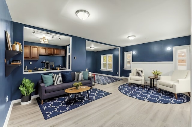 living room with light hardwood / wood-style flooring