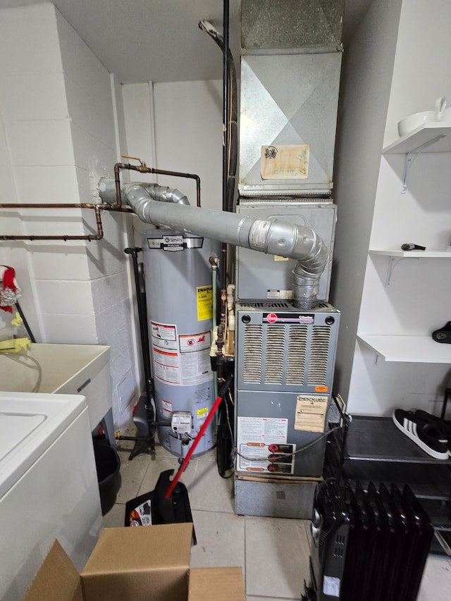 utilities featuring gas water heater and washer / dryer