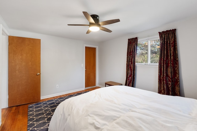 bedroom with hardwood / wood-style floors and ceiling fan