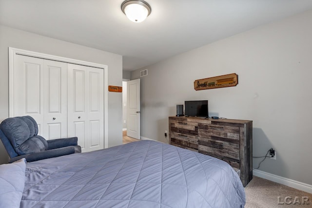 carpeted bedroom featuring a closet