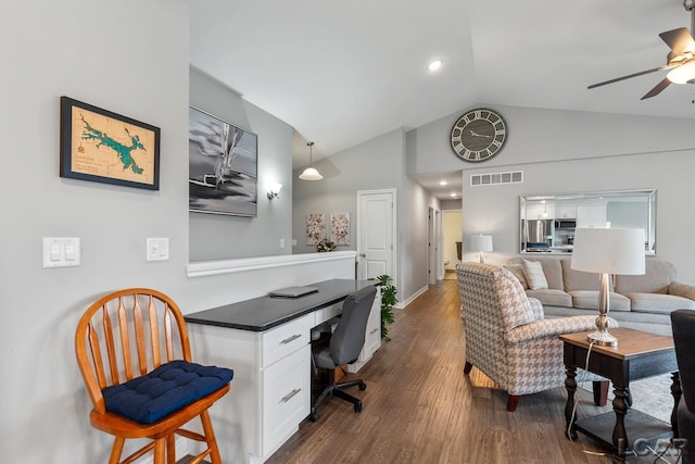 office featuring dark hardwood / wood-style flooring, vaulted ceiling, and ceiling fan