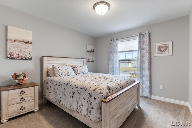 bedroom with dark colored carpet