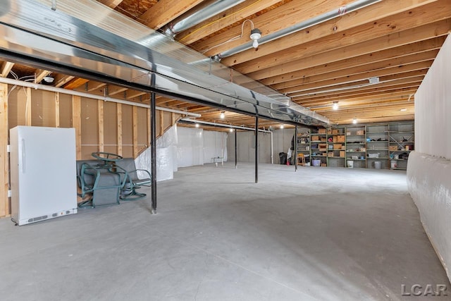 basement with white fridge