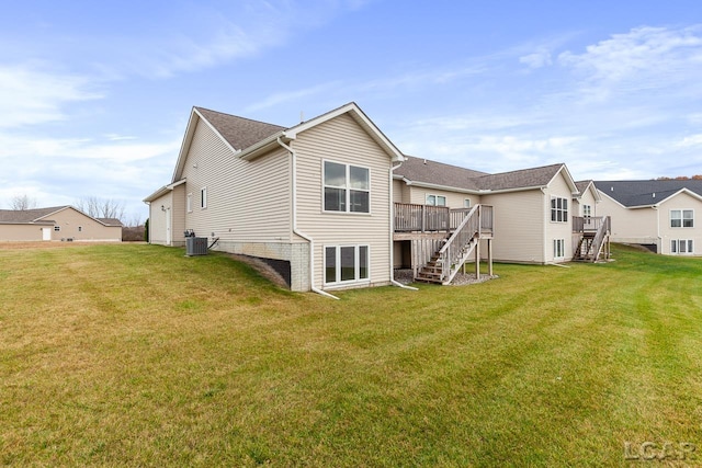 back of house with a yard, cooling unit, and a wooden deck