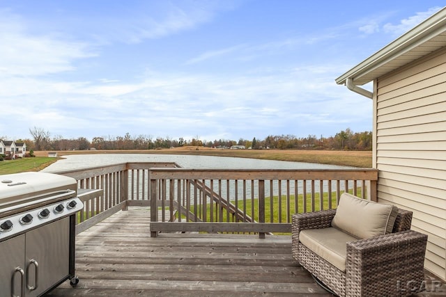 wooden deck featuring a water view