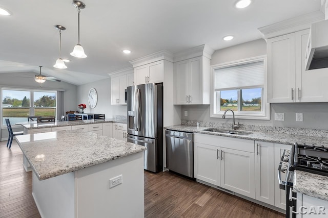 kitchen featuring lofted ceiling, white cabinets, sink, ceiling fan, and appliances with stainless steel finishes