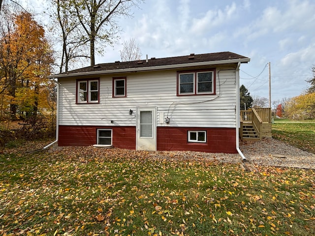 back of house with a yard