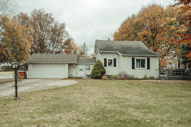 317 Maiden Ln, Saint Joseph, MI 49085 - view of front of property featuring an attached garage, a front yard, driveway, and roof with shingles