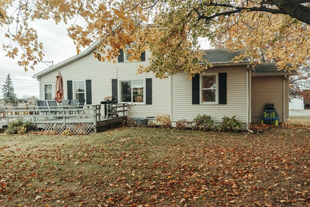 317 Maiden Ln, Saint Joseph, MI 49085 - back of house with a wooden deck and a lawn