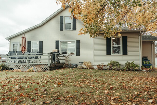 317 Maiden Ln, Saint Joseph, MI 49085 - rear view of house with a wooden deck and a lawn