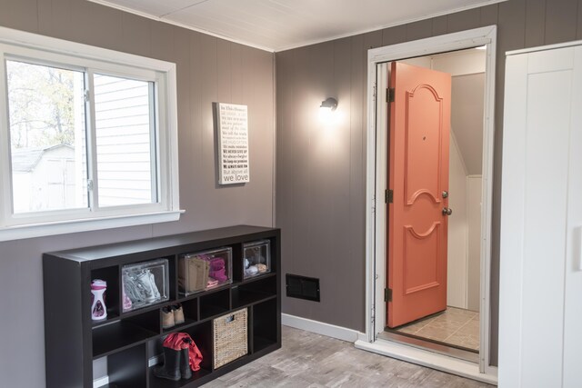 317 Maiden Ln, Saint Joseph, MI 49085 - rec room with crown molding and light wood-style flooring