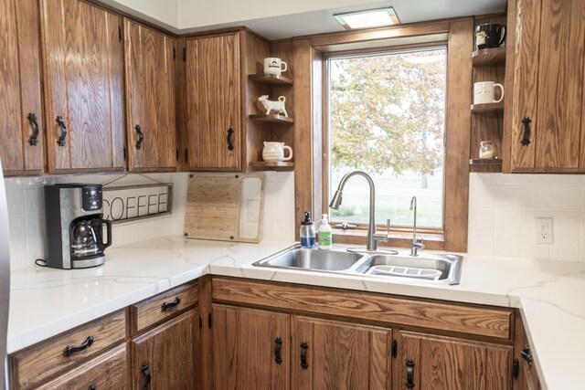 317 Maiden Ln, Saint Joseph, MI 49085 - kitchen with open shelves, a sink, brown cabinetry, and tasteful backsplash