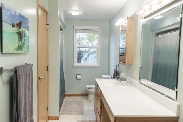 317 Maiden Ln, Saint Joseph, MI 49085 - full bath with baseboards, vanity, toilet, and a shower with curtain