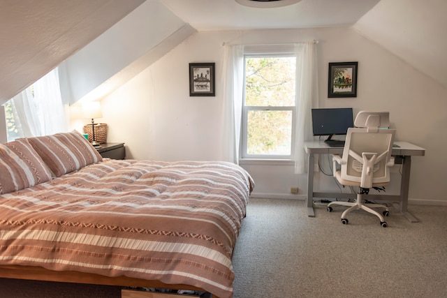 bedroom featuring carpet flooring and lofted ceiling