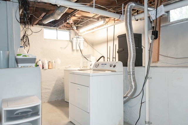 laundry area featuring washer and clothes dryer and a healthy amount of sunlight