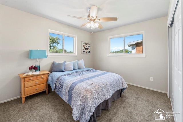 bedroom with carpet floors, a closet, multiple windows, and ceiling fan