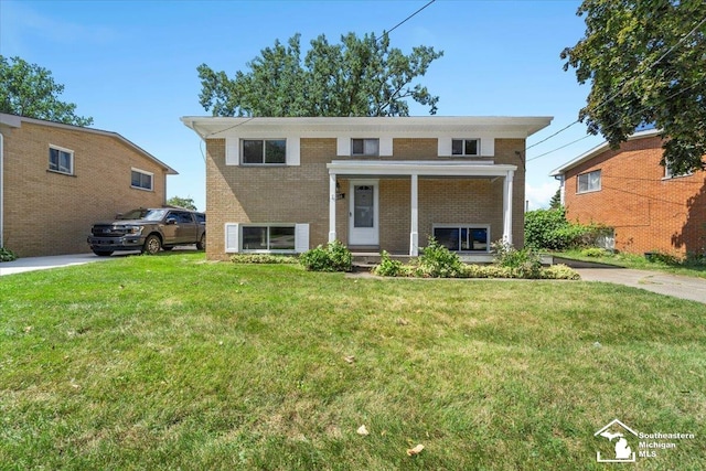 raised ranch with a front yard