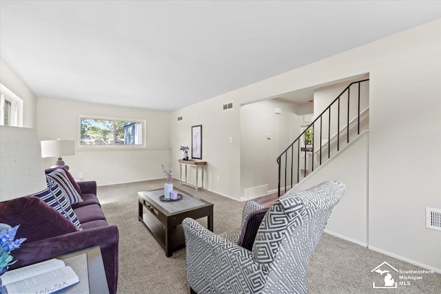 living room with light colored carpet