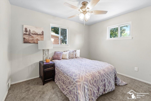 bedroom featuring ceiling fan and light carpet