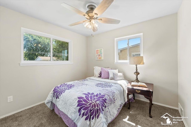 bedroom featuring ceiling fan and carpet