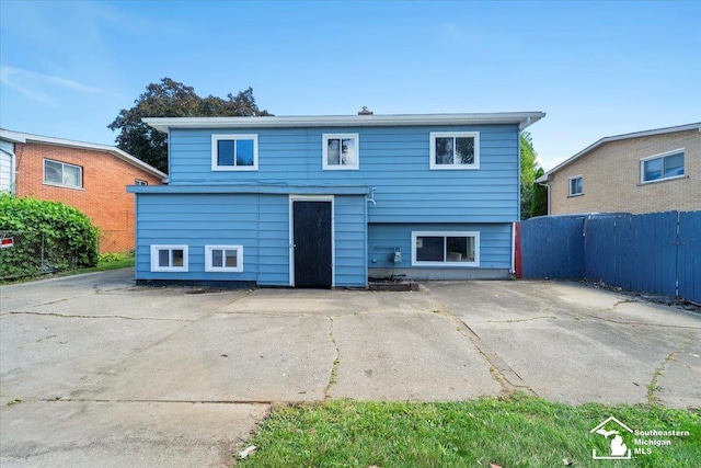 rear view of property featuring a patio