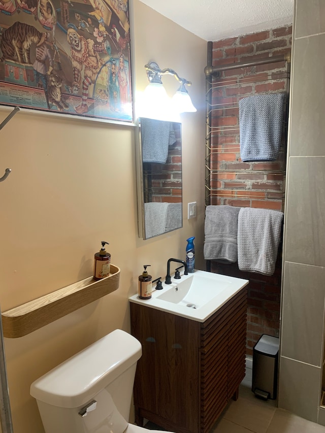 bathroom with tile patterned floors, vanity, and toilet