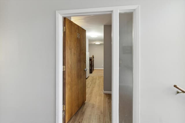 hallway featuring light wood-type flooring