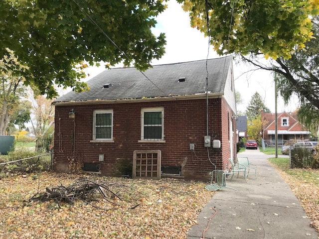 rear view of property featuring a patio area