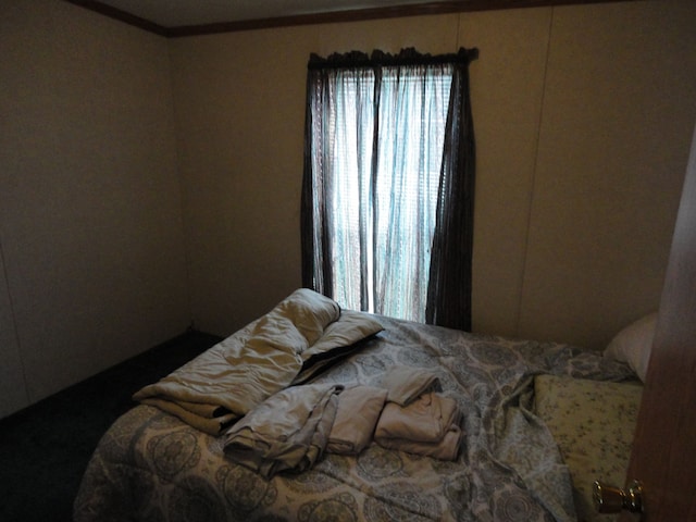 bedroom with ornamental molding