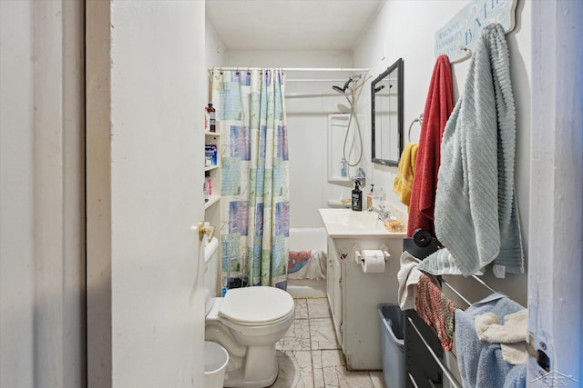 full bathroom with tile patterned floors, toilet, shower / bathtub combination with curtain, and sink