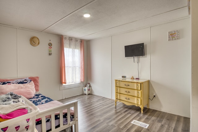 bedroom featuring wood-type flooring