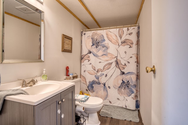 bathroom with a shower with curtain, vanity, a textured ceiling, hardwood / wood-style floors, and toilet