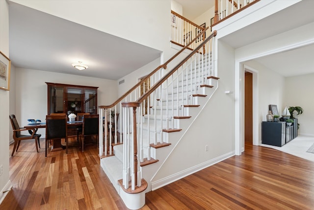 staircase with wood-type flooring