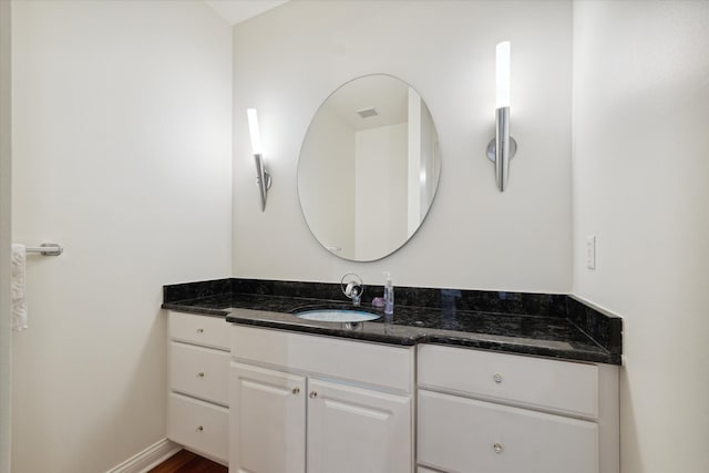 bathroom with wood-type flooring and vanity