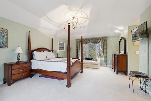 carpeted bedroom featuring vaulted ceiling