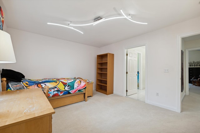 bedroom featuring light colored carpet